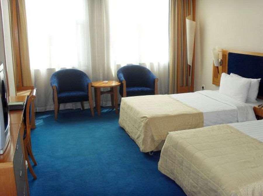 Beijing Wuhuan Hotel Kamer foto